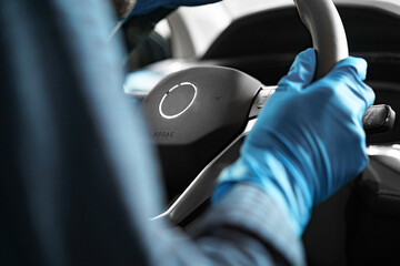 A man cleaning car interior, car detailing in Carwash service