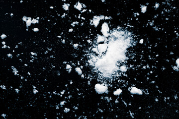 Snow wrecks, scattered on black background.