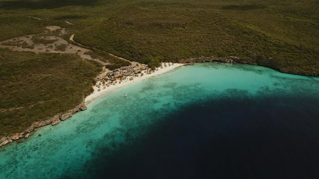 High altitude drone shot  at the caribbean beach of the Kenepa beach of Curacao