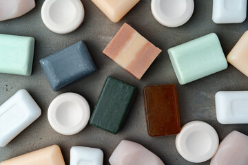 Soap bars on gray background flat lay
