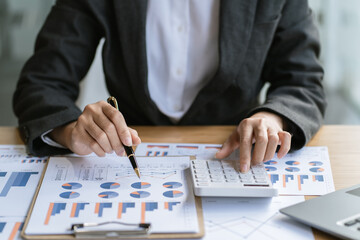 Businessman is deeply reviewing a financial report for a return on investment or investment risk analysis.