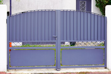 grey steel gate house portal of gray old traditional european house