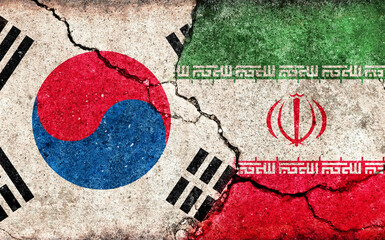 South korea vs Iran (Economical or Political  conflict). Grunge country flag illustration (cracked concrete background)