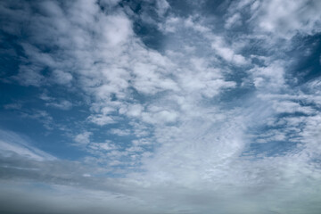 blue cloudy sky on a sunny day background screensaver backdrop