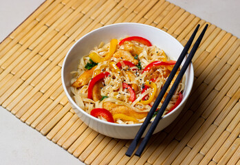 Udon noodles with chicken, pepper and sesame. Chinese food.