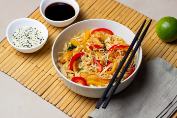 Udon noodles with chicken, pepper and sesame. Chinese food.