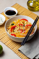 Udon noodles with chicken, pepper and sesame. Chinese food.