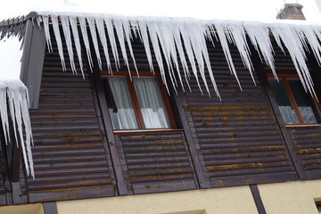 icy stalactites on the house 