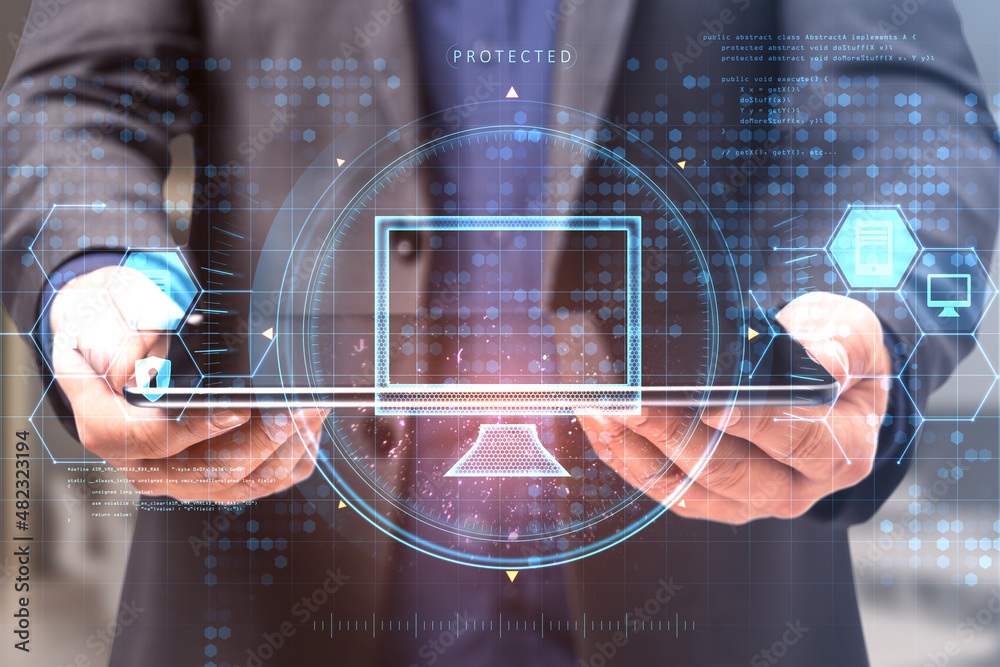 Poster close up of business man hand holding tablet with creative glowing computer hologram interface on bl