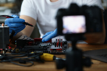 A man makes a vlog on repairing a pc