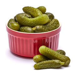Plate of Tasty canned Whole green cornichons isolated on a white background