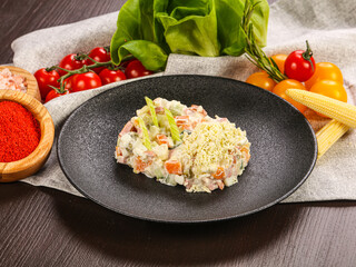 Traditional Russian salad Olivier with sausages