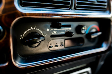 Fototapeta premium Manual heating, cooling system on an old japanese 4wd car close up, shallow depth of field, space for text.