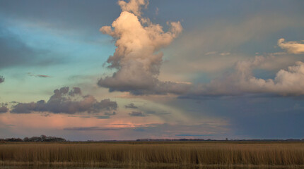 The Bodden landscape of Zingst with dramatic sky and reflection in the water.