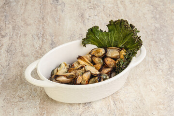 Tasty marinated mussels in the bowl