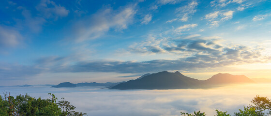 Beautiful foggy winter sunrise on the mountains in the northeast of Thailand.