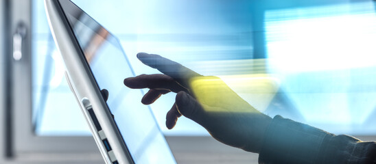 Hand of engineer using tablet PC at home office