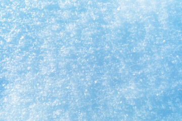 Abstract texture of snow illuminated by sunlight, top view