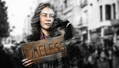 A dirty disheveled woman holds a cardboard sign with the text homeless. Defocused background with...