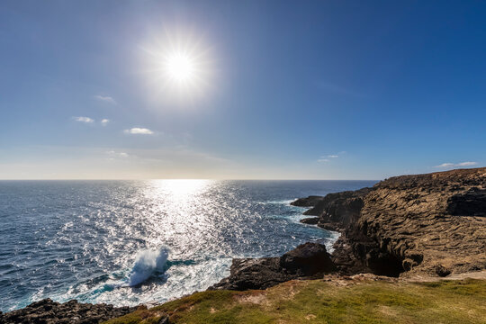 Australia, Victoria, Cape Bridgewater, Sun shining over Bridgewater Blowholes