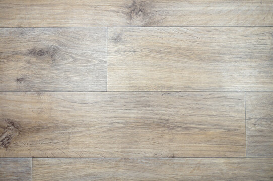 Flooring, parquet with a pattern of knot elements. Brickwork. Horizontal arrangement.