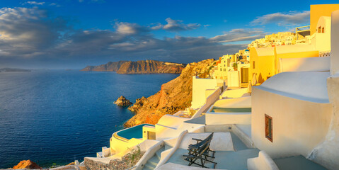 Picturesque sunset on famous view resort over Oia town on Santorini island, Greece, Europe. luxury travel. famous travel landscape. Summer holidays. Travel concept background.