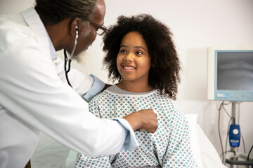 Doctor examining heartbeat of patient at hospital