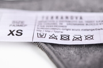 Tag on women's panties.Laundry advice. Clothes label, close-up.