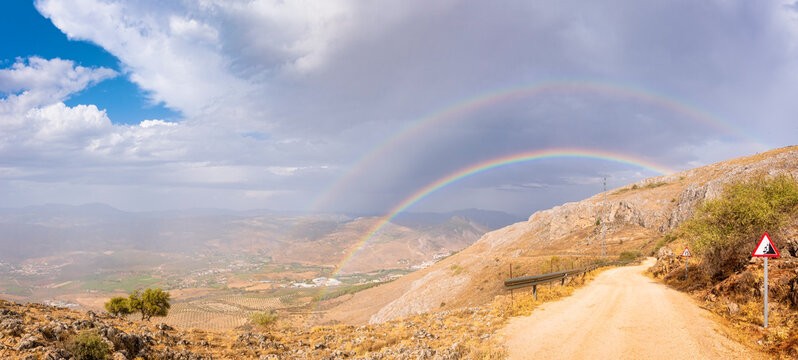 Double rainbow over mountains seen from Mirador Sierra Gorda, Andalucia, Spain, Europe