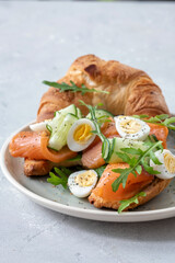 Croissant Sandwich with salmon, cucumber and eggs