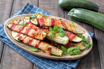 Grilled zucchini fries wrapped with a bacon