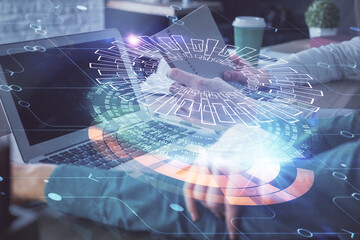 Double exposure of man and woman working together and technology theme drawing hologram. Big data concept. Computer background.