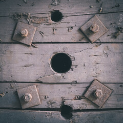 Old wooden planks with holes