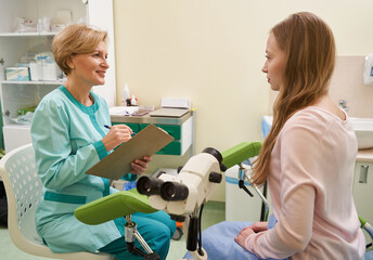 Charming female person looking at her gynecologist