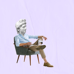 Male model wearing retro clothing headed of ancient statue head sitting in armchair. Concept of...