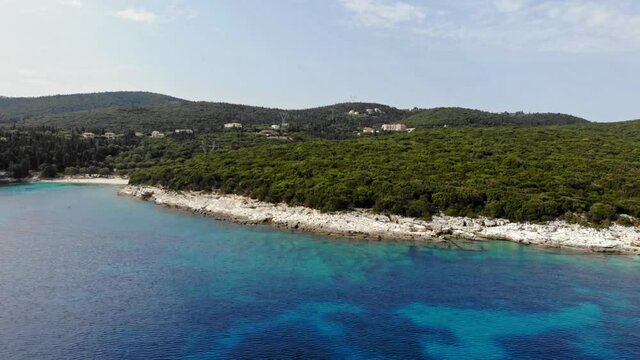 Rocky Seashore And Lush Green Forest Of Alexia Beach In Erisos, Greece. aerial