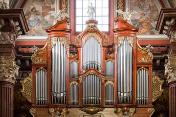 The organ in the Baroque parish church in Poznan, Poland. Fragment of the instrument. - obrazy, fototapety, plakaty