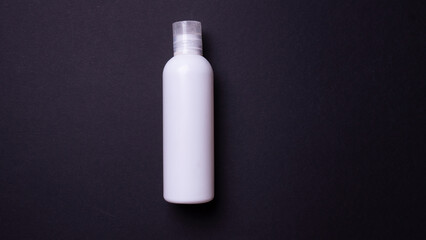 hand cream packaging on black background