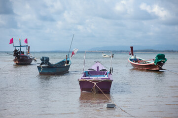 Fototapeta premium Travel by Thailand. Seascape with traditional fishing boats.