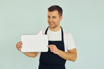 Sincere emotions. Man standing in the studio with empty signs for the text