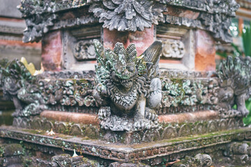 Sculpture and religion. Traditional hindu statue of demon at Bali temple.