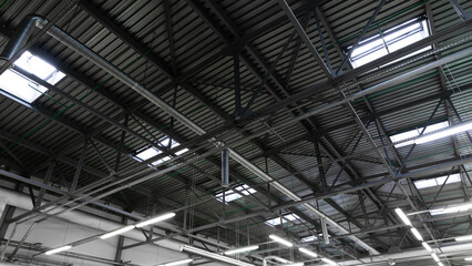 interior of the industrial Hangar with a ventilation system under the roof and glazing in the ceiling