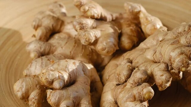 Whole ginger root on close up rotating 4K