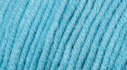 Texture of blue cotton yarn and acrylic blended yarn close up. Spring-summer knitting season.