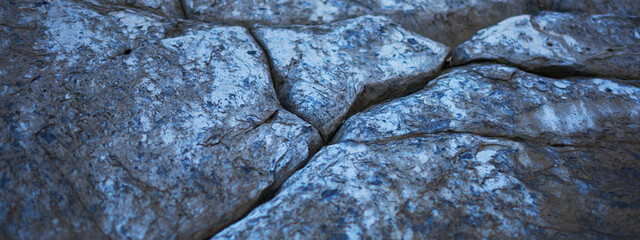 Stones texture and background. Rock texture. Dark grey black slate background or texture.