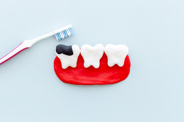 Teeth models with toothbrush. Oral health and care concept