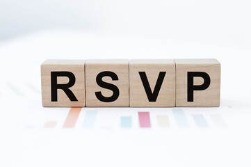 Word rsvp on wooden cubes on a light background on colored graphs