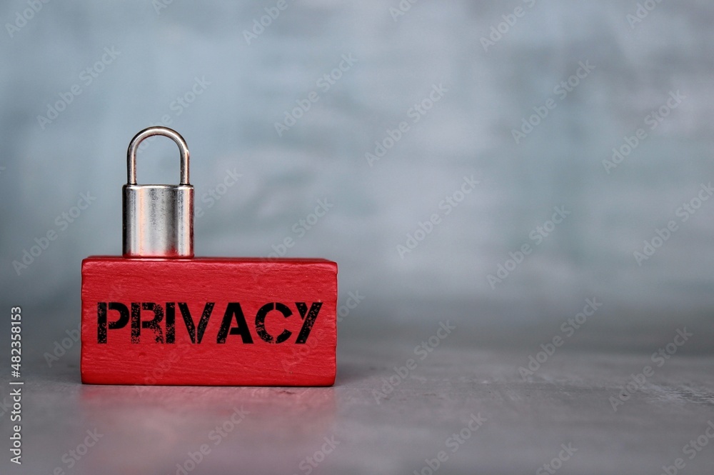 Wall mural close up image of padlock on wooden cube with text privacy. copy space for text