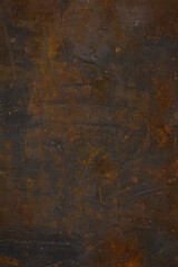 Dark Iron cast iron sheet with patina and rust. Brown and black metallic texture. 