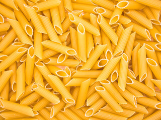 Penne pasta background. Top view